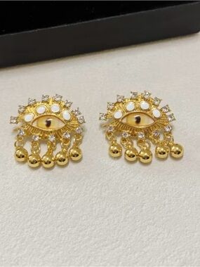 Schiaparelli Inspired Gold Eye Drop Statement Earrings